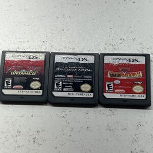 Lot of three Nintendo DS cartridge only games Spider-Man, cars, & ATV